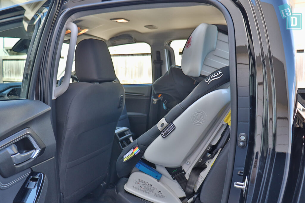 Mazda BT-50 and Isuzu D-Max with rear-facing infant capsule and forward-facing child seat installed