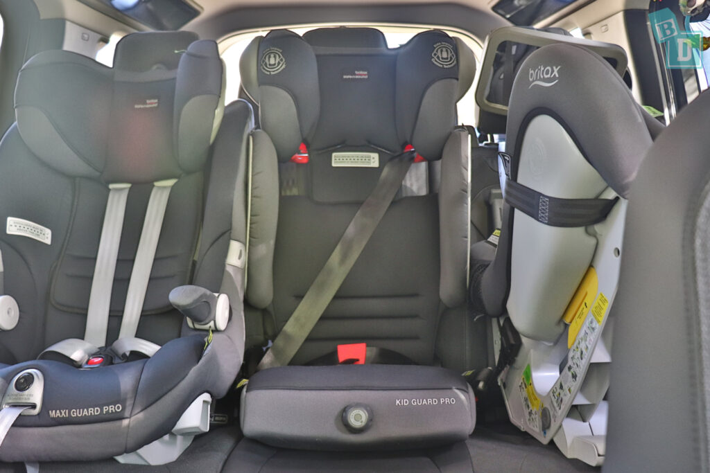 2021 Land Rover Defender 110 with three child seats installed in the second row