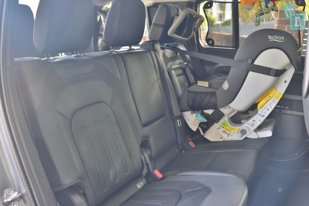 2021 Land Rover Defender 110 with rear facing child seat installed in the second row