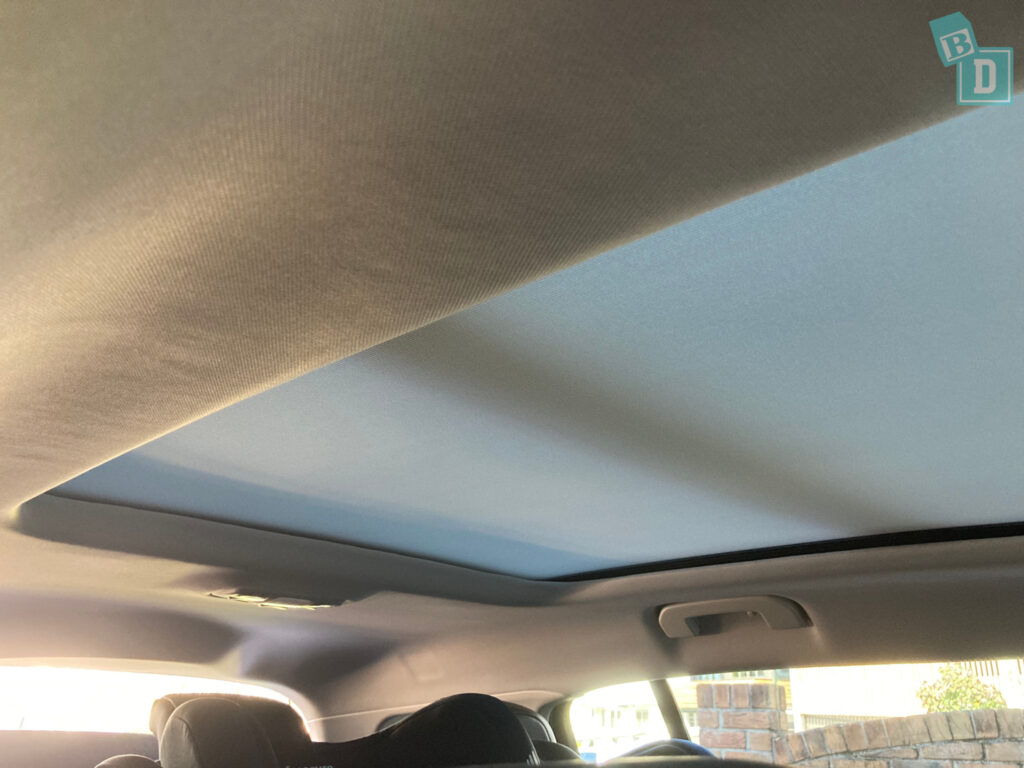 a car with a sunroof in the back seat.