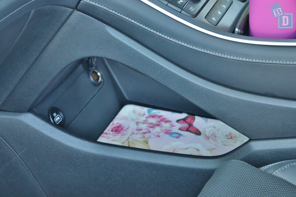 a car with a pink flower in the center console.