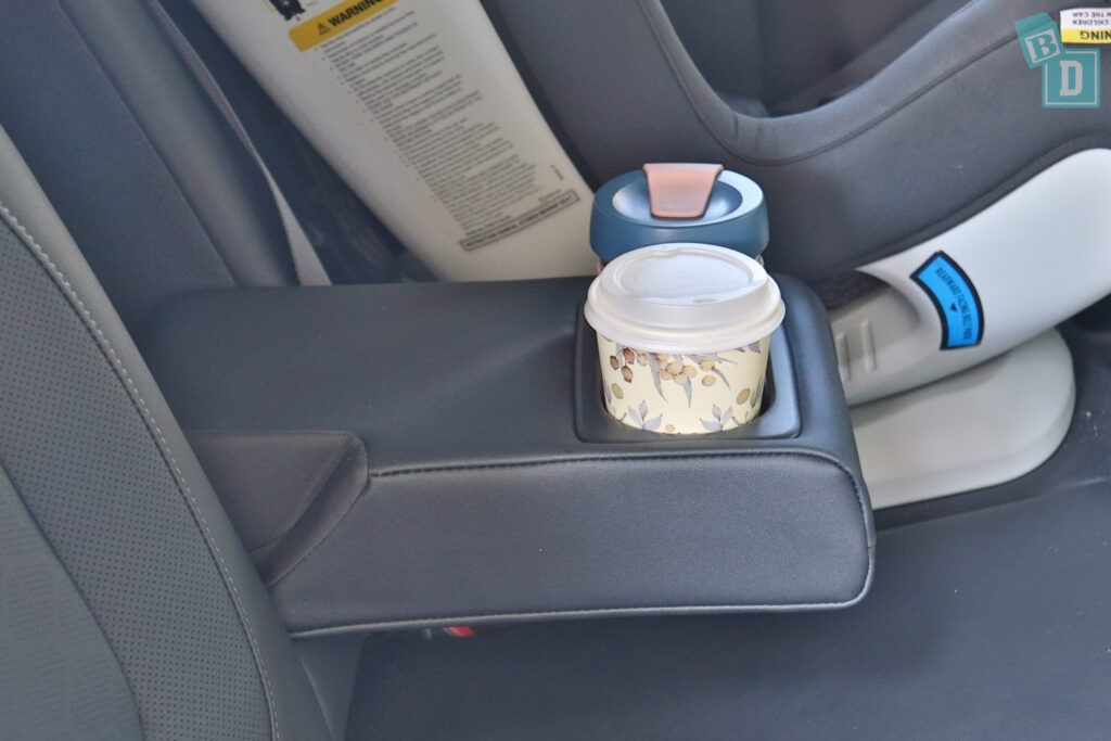 a cup holder in the back seat of a car.