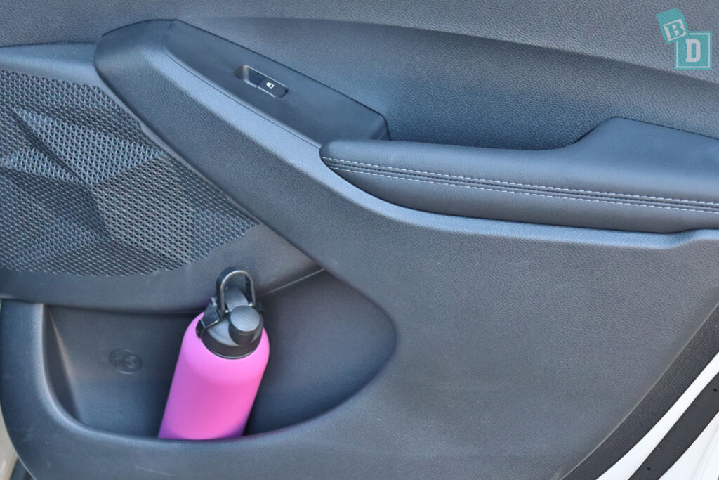 a car with a pink bottle in the back seat.