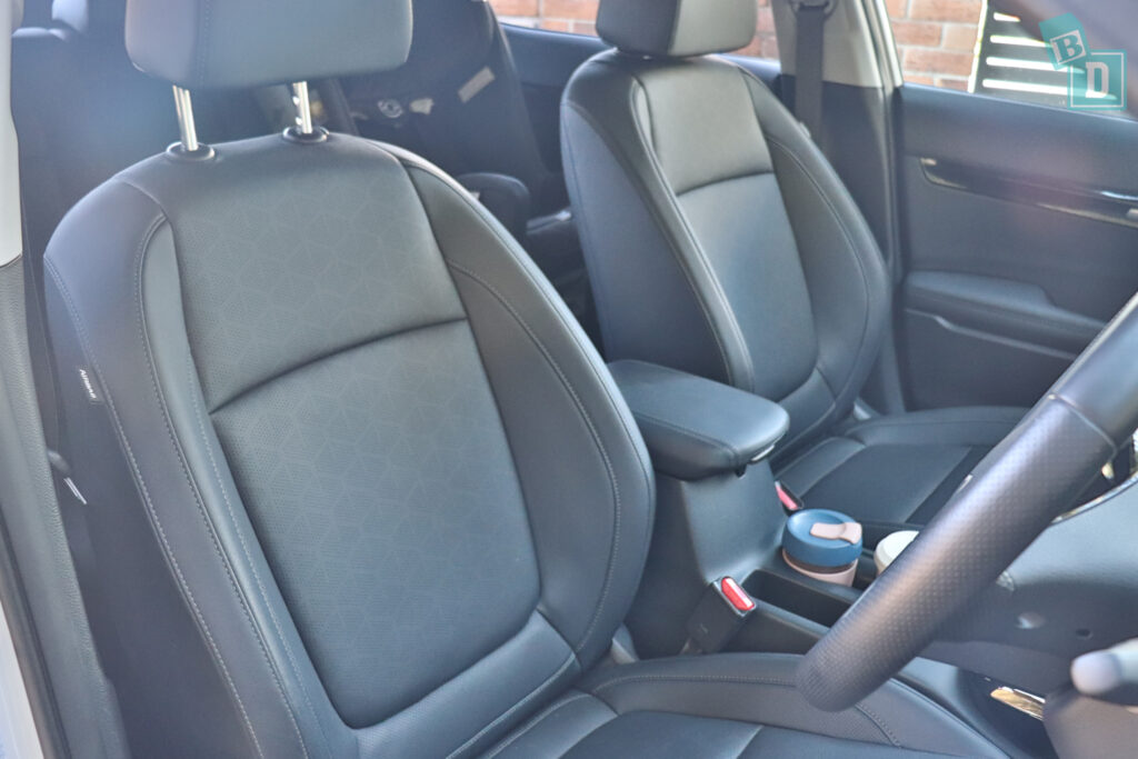the interior of a car with black leather seats.