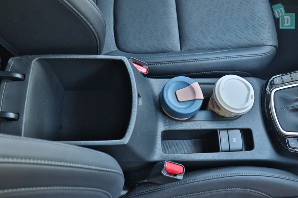 a cup holder in the back seat of a car.