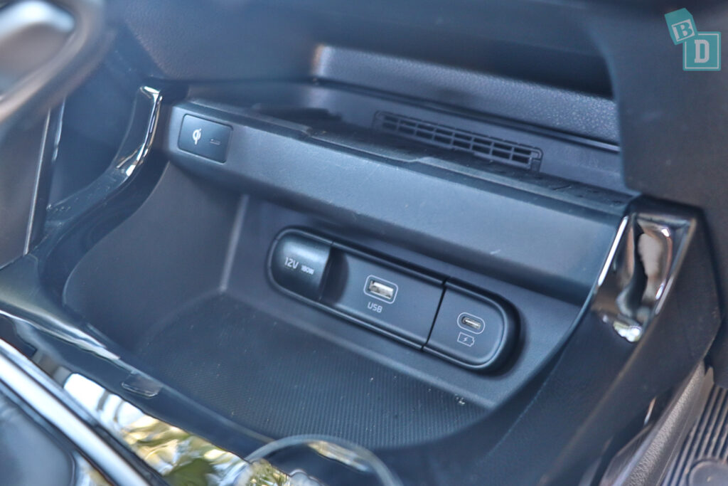 the center console of a car with a touch screen.