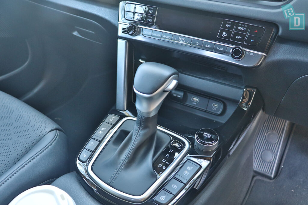 the interior of a car with a steering wheel and gear shifter.