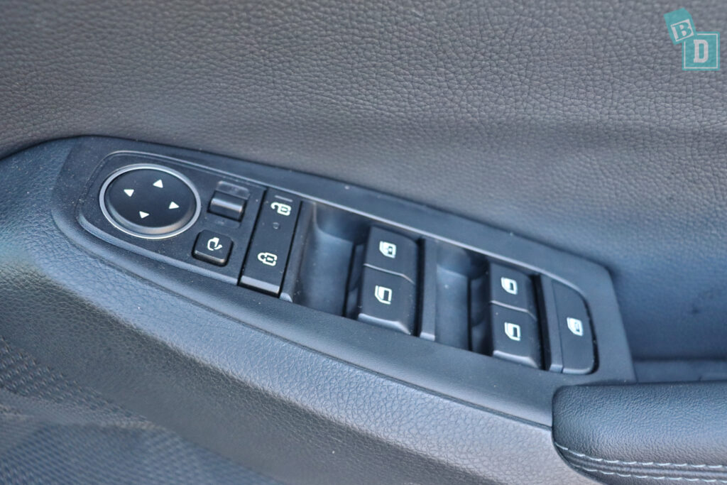 the control panel of a car with buttons on it.