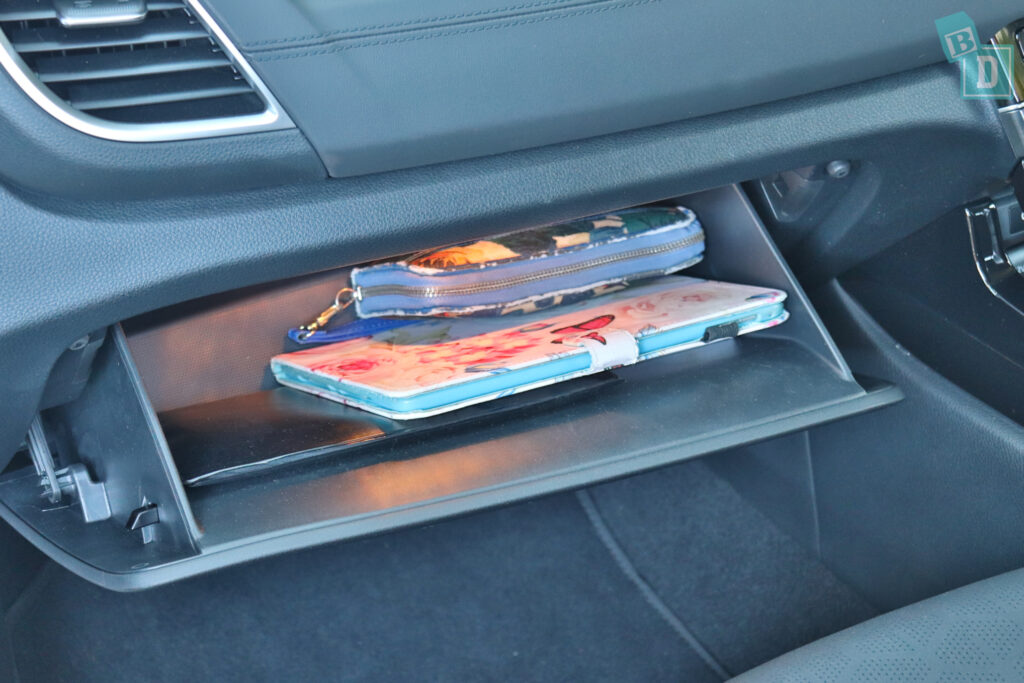 a car with a cell phone in the center console.