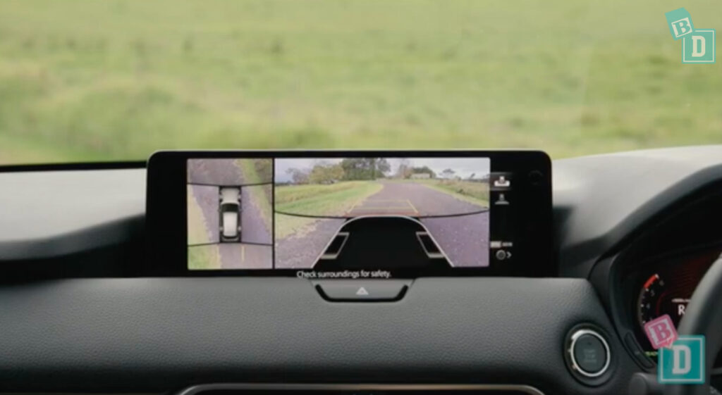 a car with a rear view camera on the dashboard.