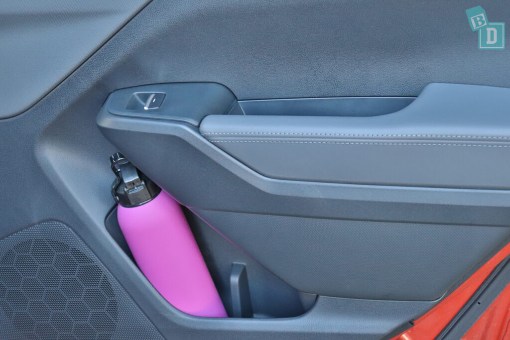 a car with a pink bottle in the back seat.