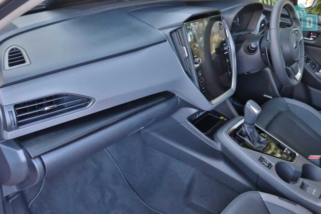 the interior of a car with a dashboard and steering wheel.