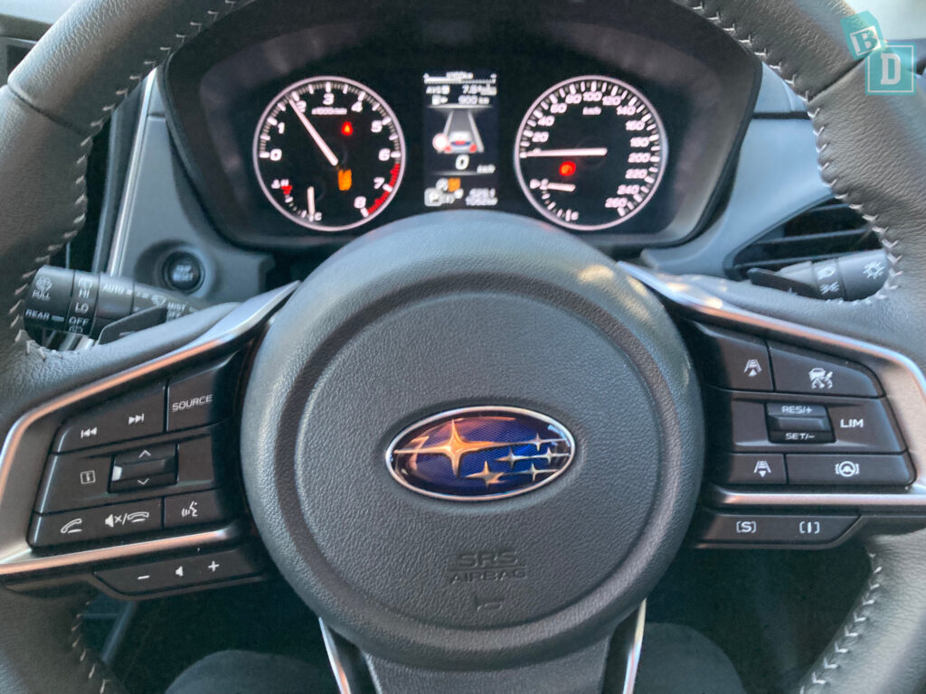 the steering wheel and dashboard of a car.