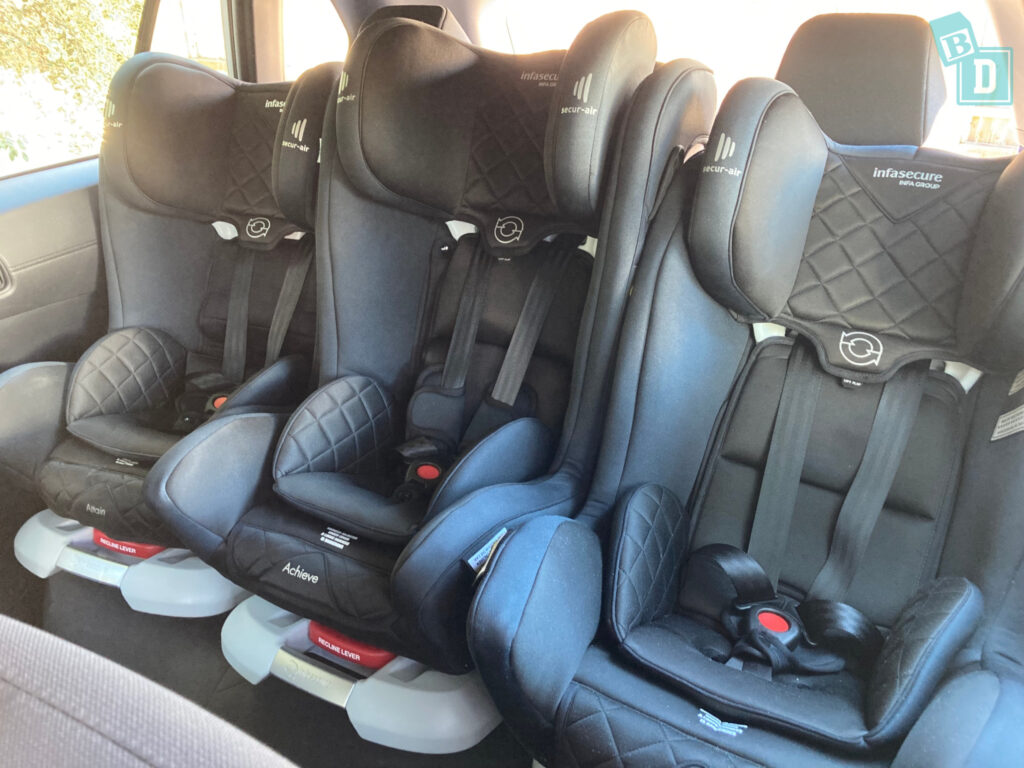 three car seats in the back of a 2023 Toyota Corolla Cross hybrid