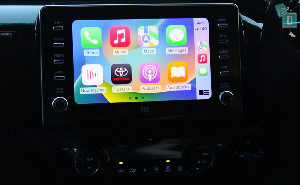 A car with an apple ipad in the dashboard.
