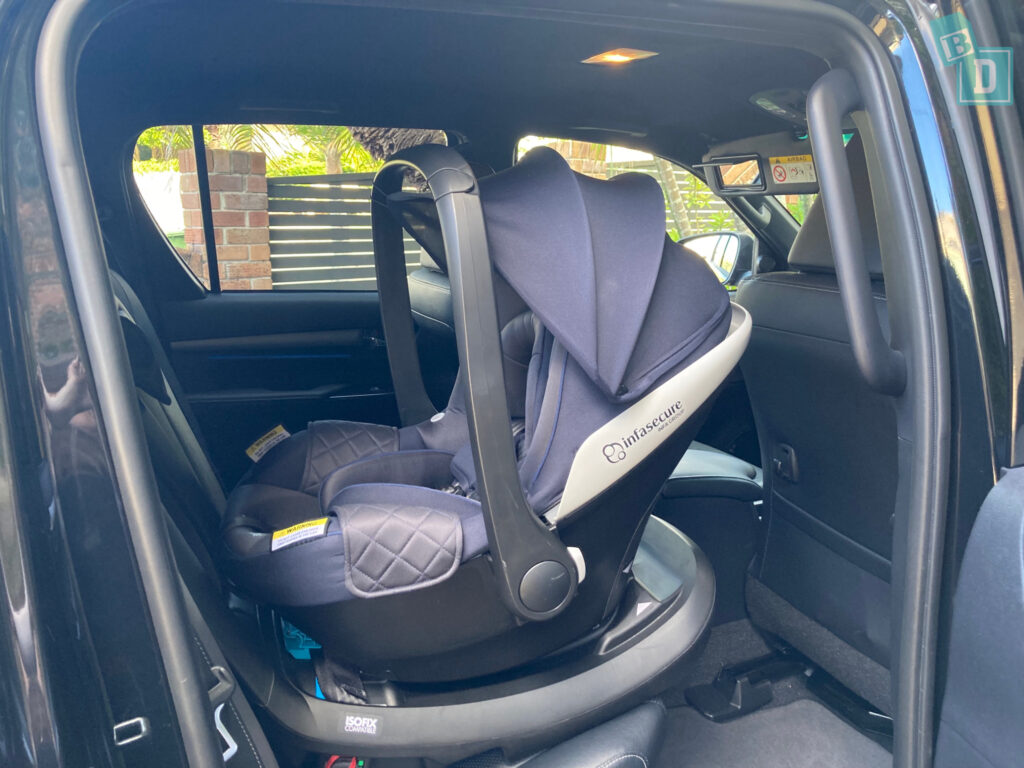 legroom with rear facing child seats infant capsules in the back of a 2023 Toyota HiLux Rogue