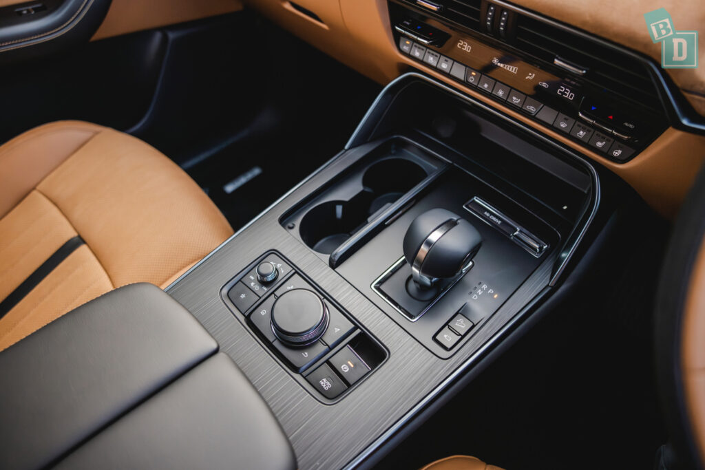 the interior of a car with tan leather and a steering wheel.