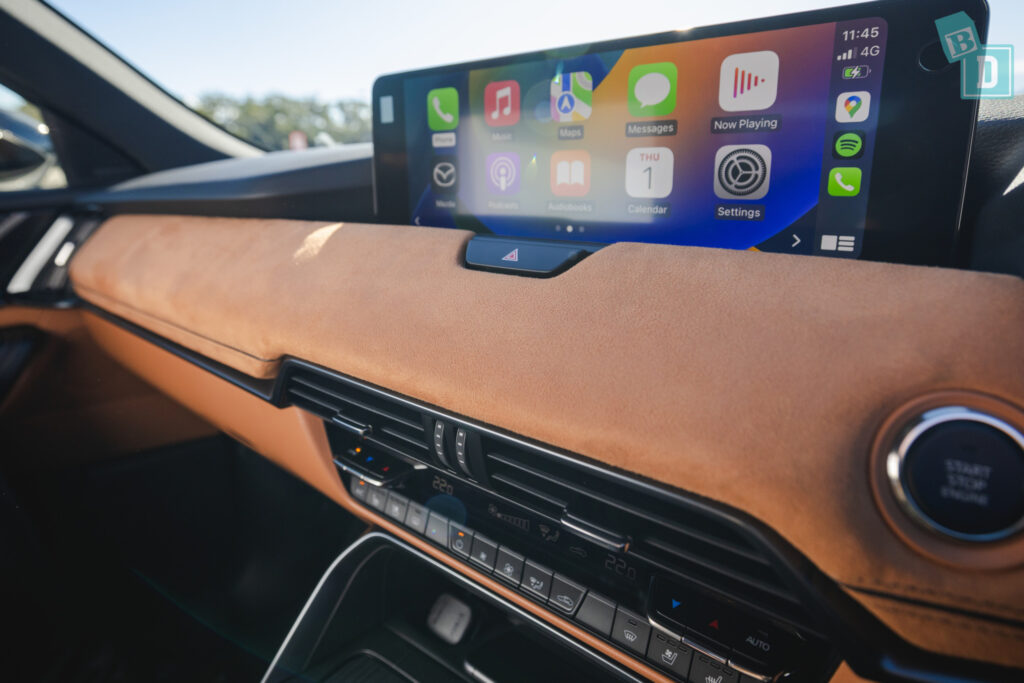 the dashboard of a car with an apple ipad.