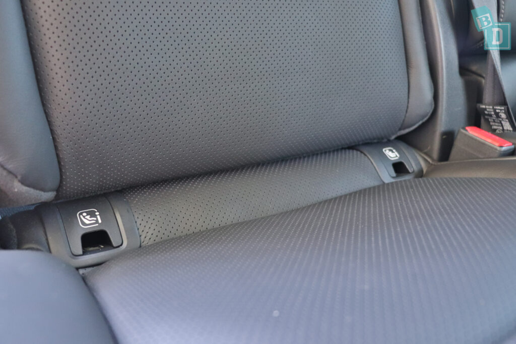 The back seat of 2023 Mazda CX-8 with a seat belt.