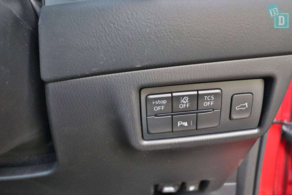 The control panel of a red car.