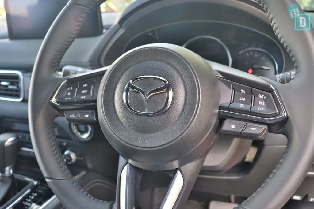 The steering wheel of a mazda cx-5.