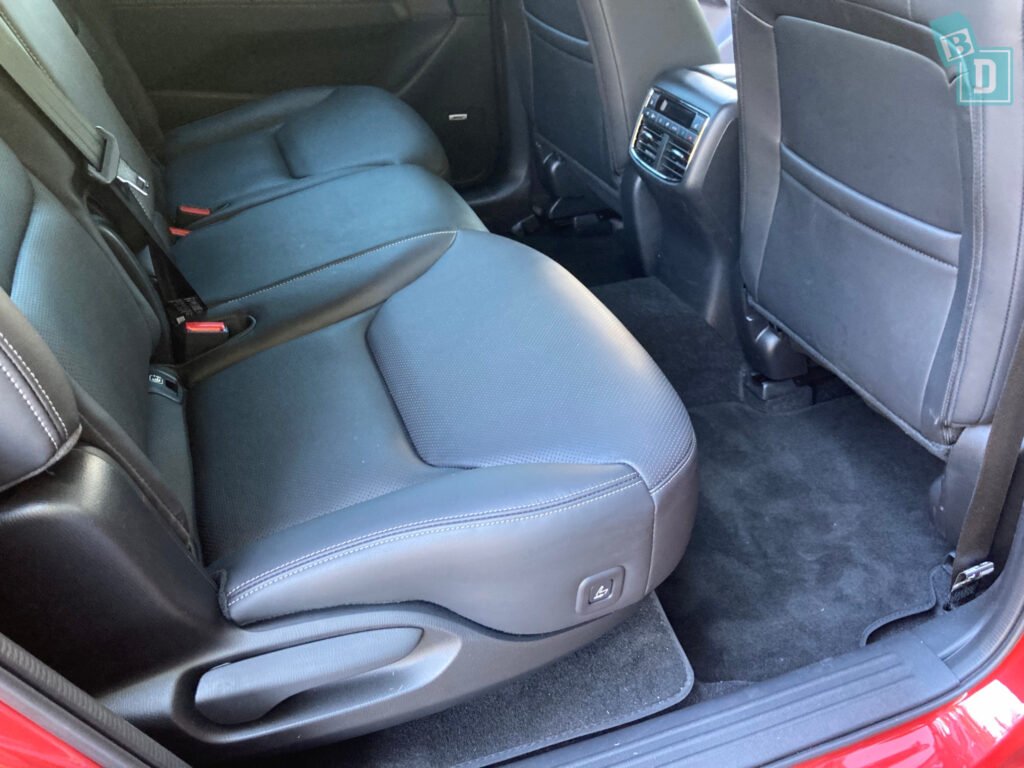 The back seats of a 2023 Mazda CX-8 with black leather seats.