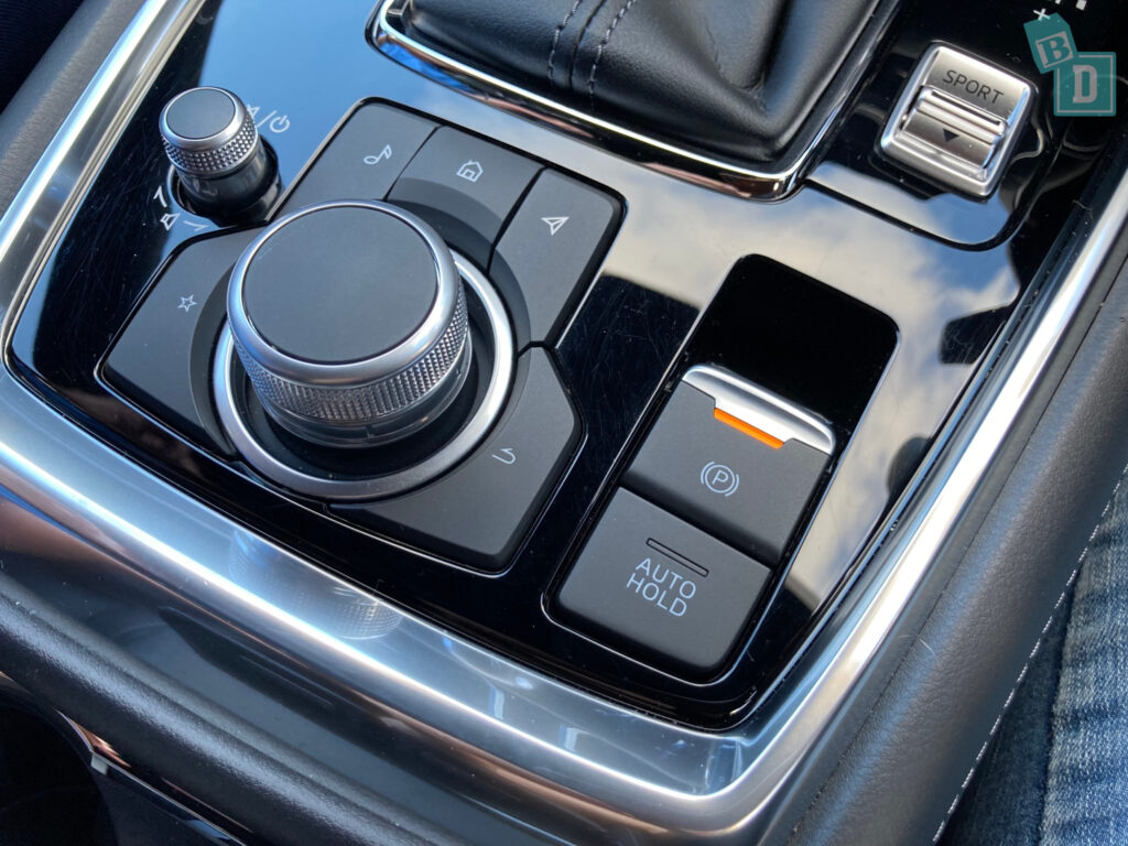 A 2023 Mazda CX-8 with a button on the dashboard.