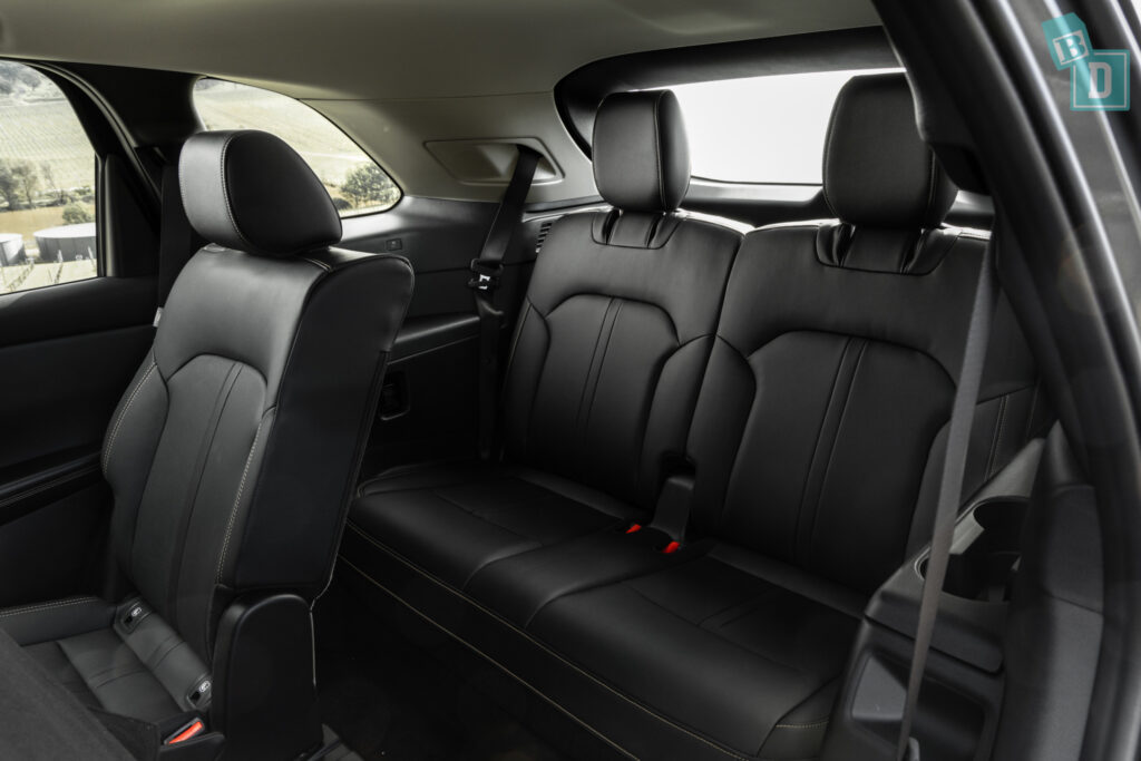 The back seats of a 2023 Mazda CX-90 with black leather seats.