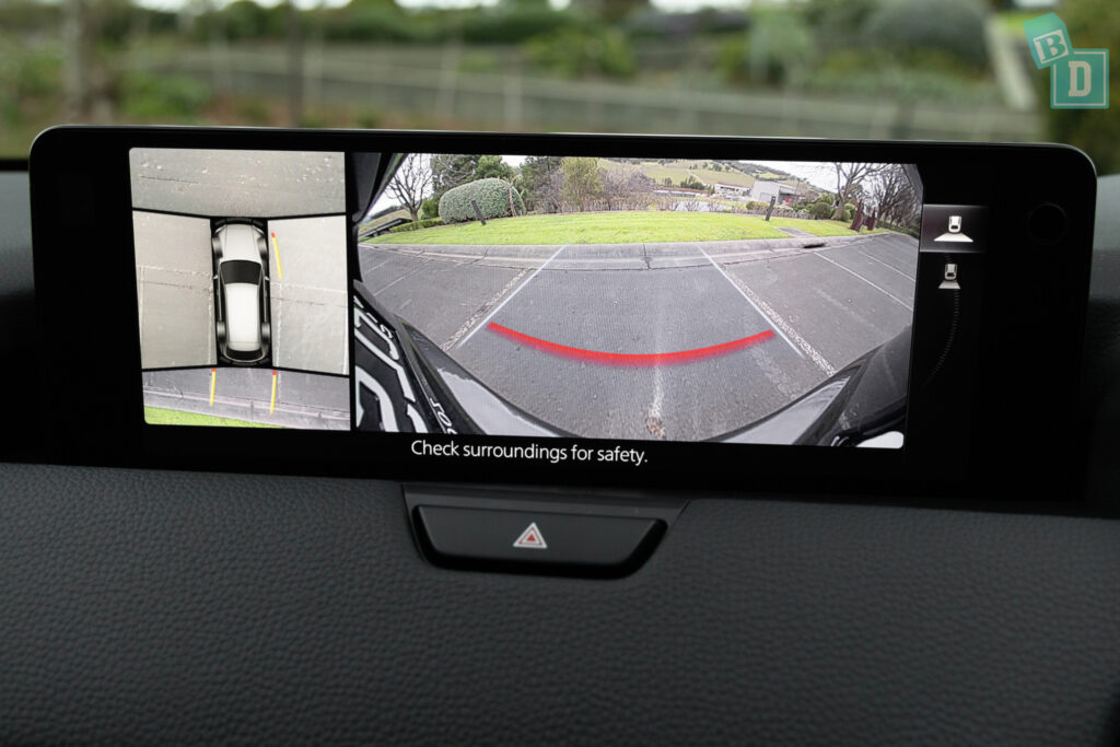 A rear view camera is shown in a 2023 Mazda CX-90 