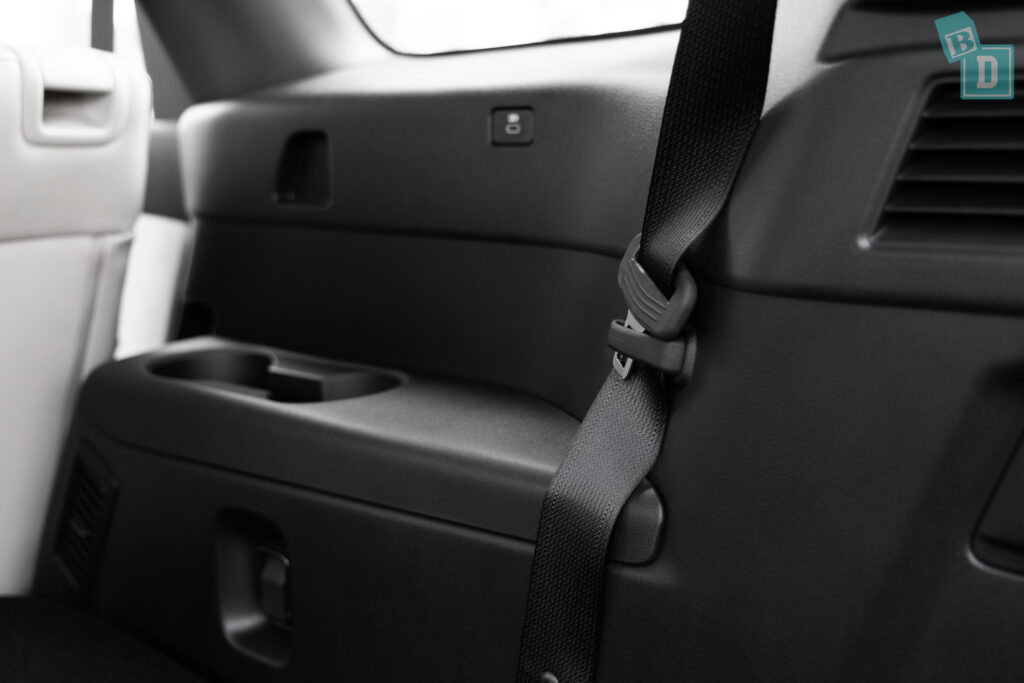 The interior of a car with a seat belt.