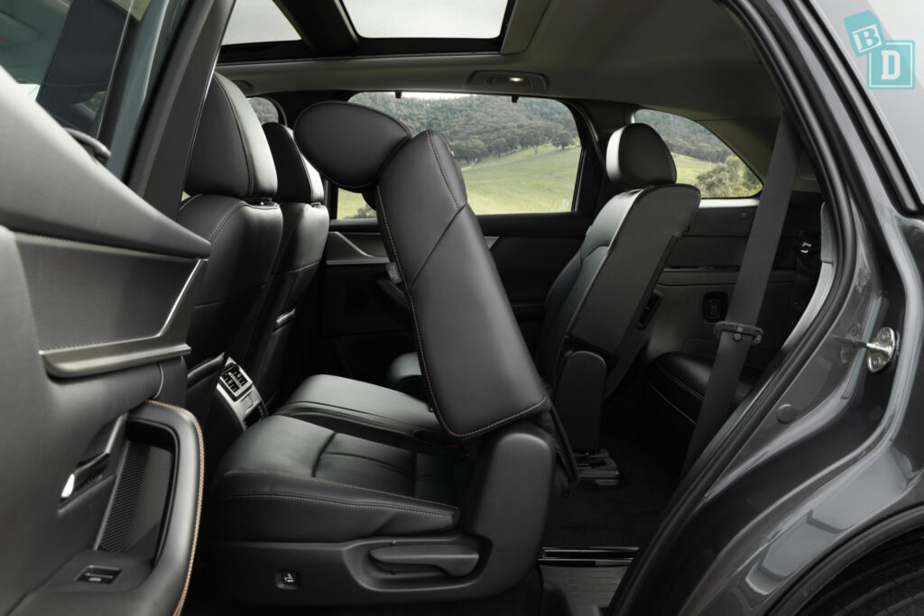 The back seats of a black suv.