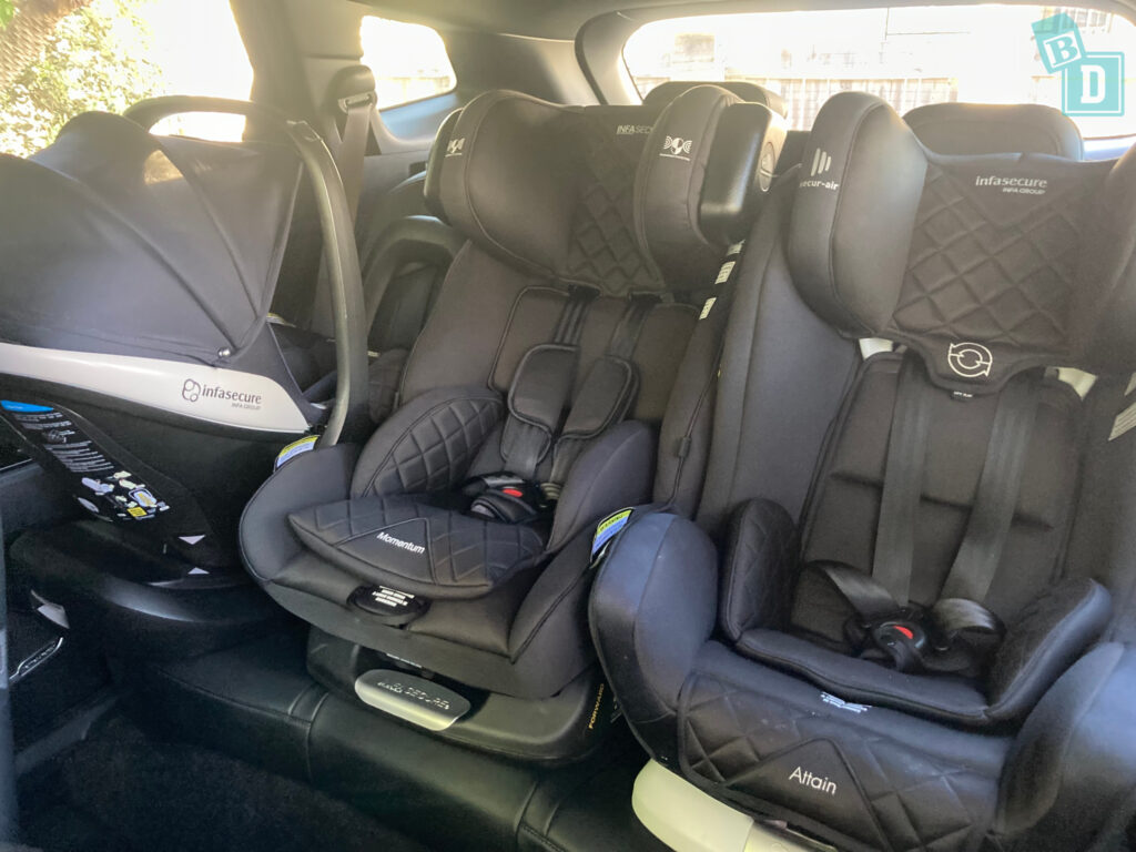 Car seats in the back seat of a car.