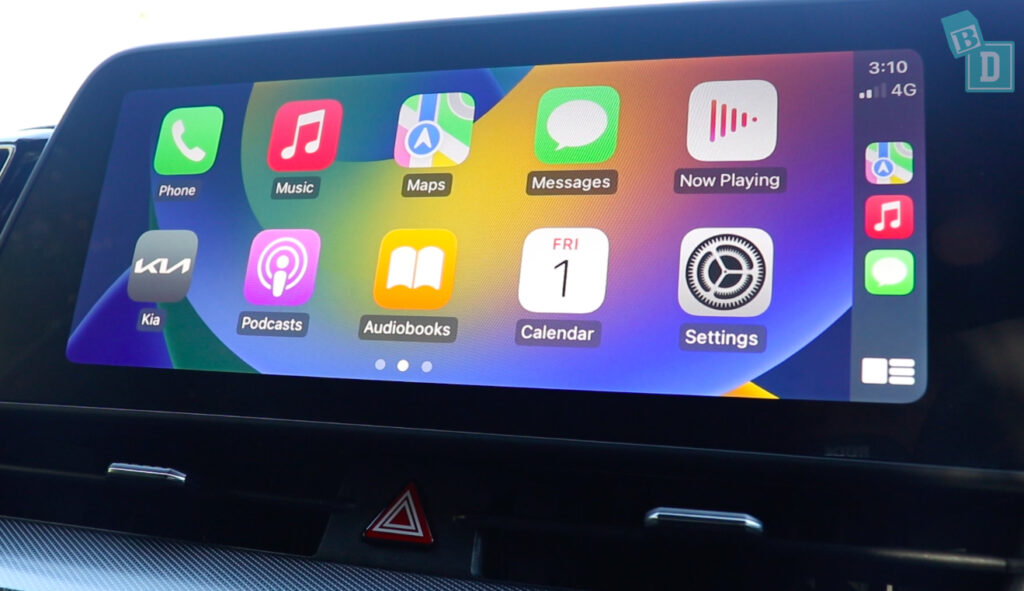 A car with an apple ipad on the dashboard.