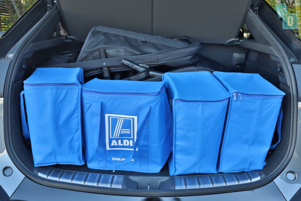 The trunk of a 2023 Lexus RZ 450e with Jiffle Wagon pram, seat and shopping