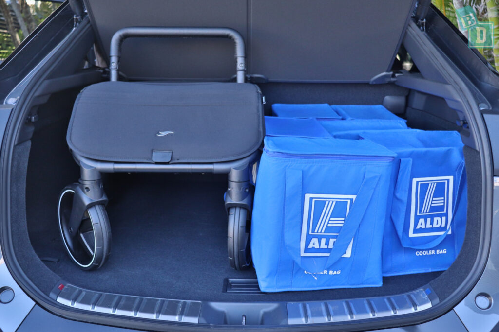 The trunk of a 2023 Lexus RZ 450e with Jiffle Wagon pram and shopping