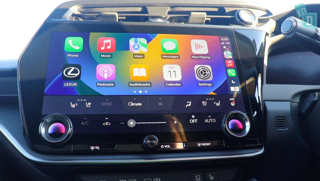 The dashboard of a car with an ipad on it.