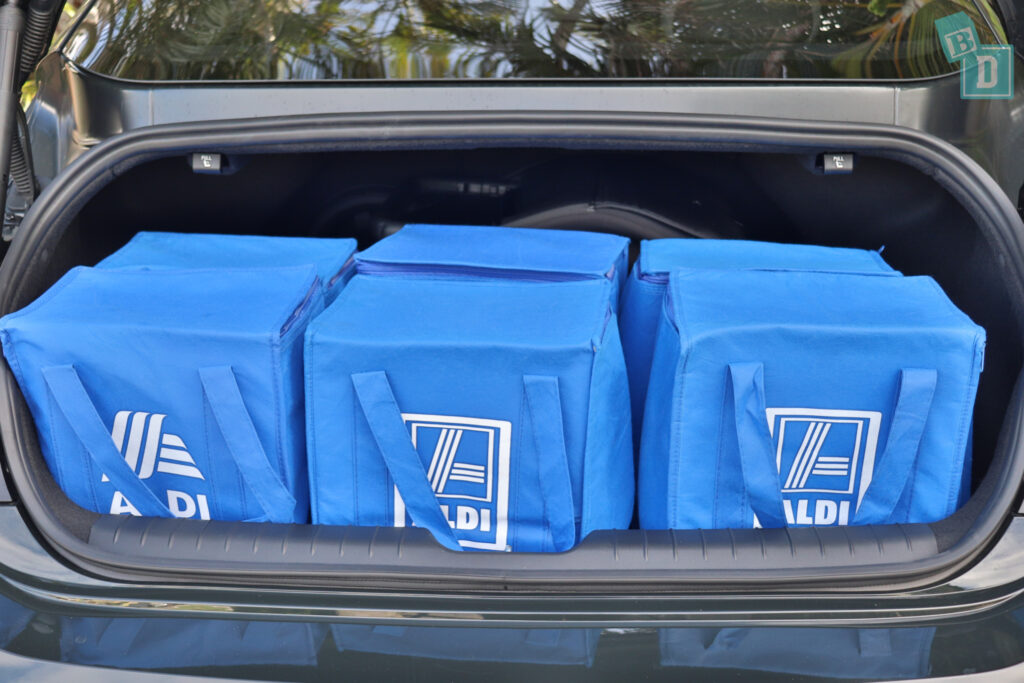 Four blue bags are in the trunk of a 2023 Hyundai Ioniq 6.