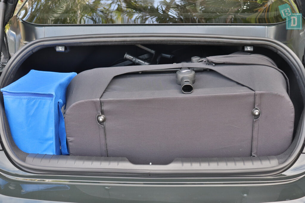 The trunk of a 2023 Hyundai Ioniq 6 is filled with prams.