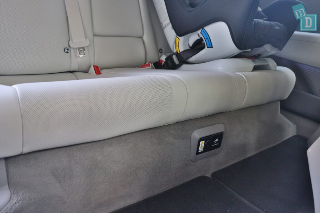 The back seat of a 2023 Hyundai Ioniq 6 with a seat belt.