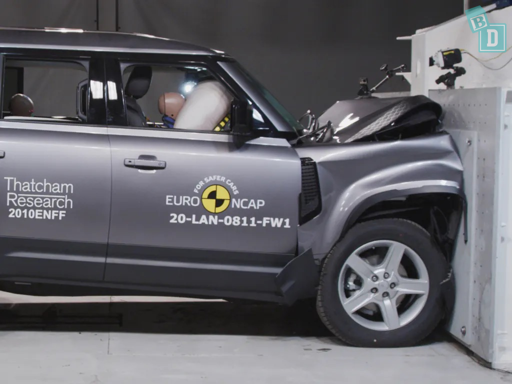 The land rover defender is shown in a crash test.