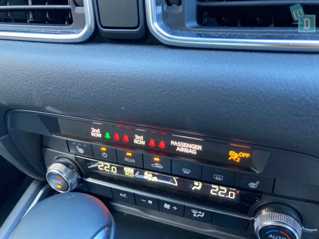 The dashboard of a car with a digital display.