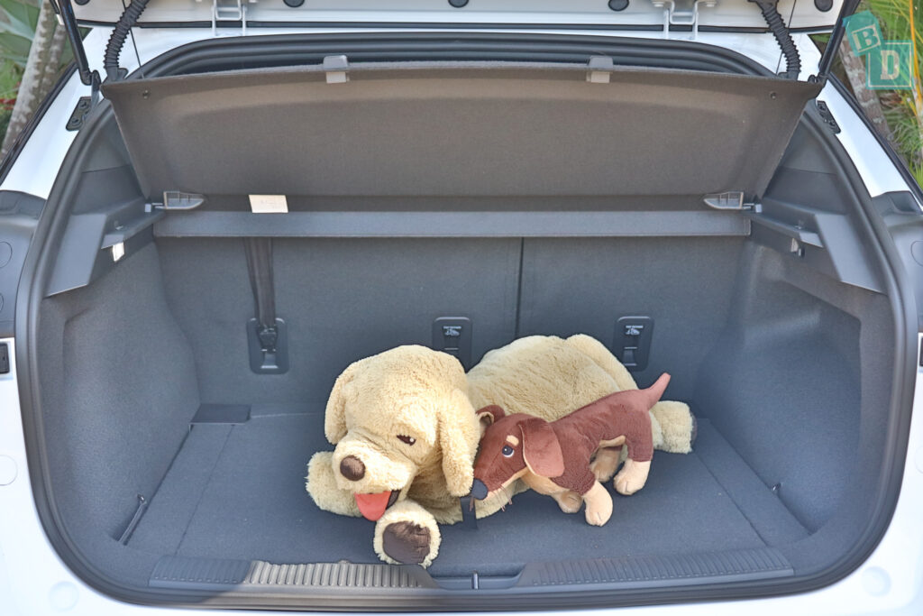 Two stuffed animals in the trunk of a 2023 MG4.