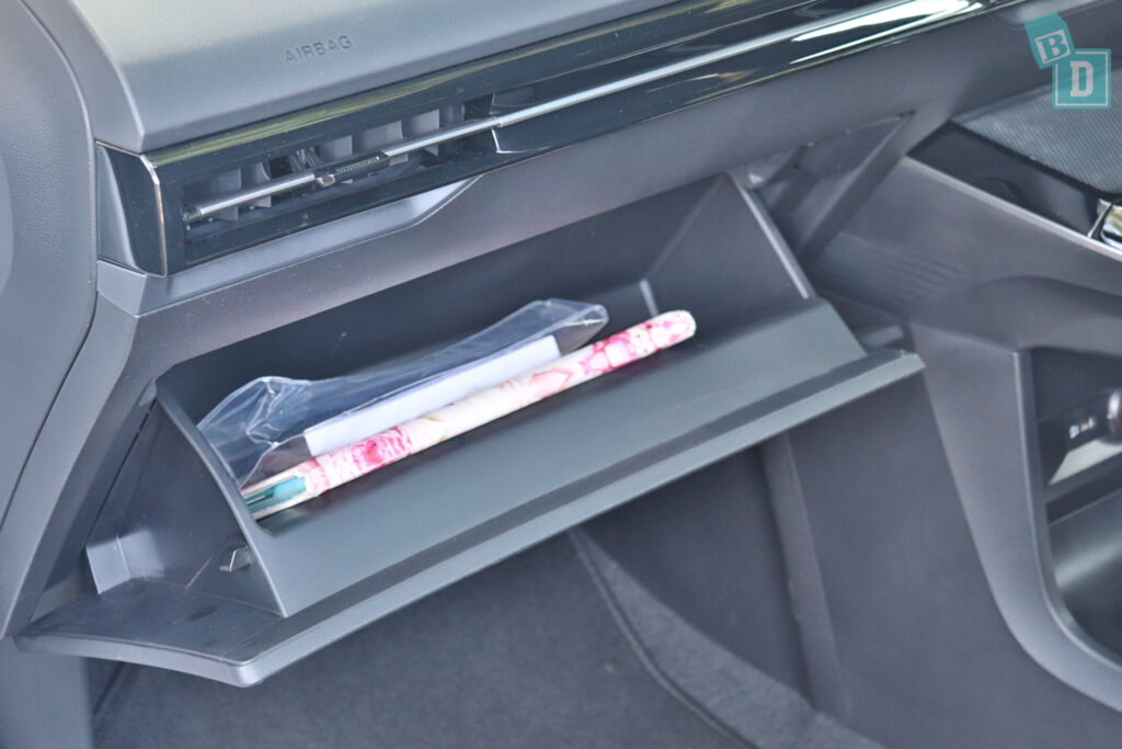 A car with a magazine in the center console.