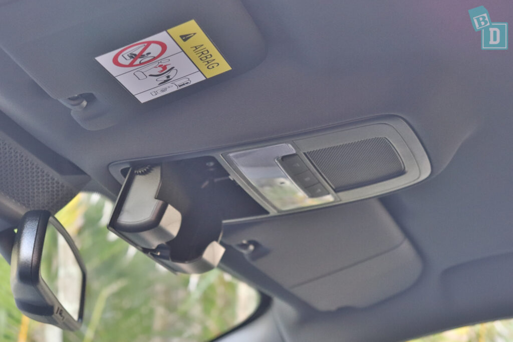 The rear view mirror of a car is shown.