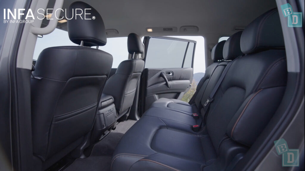 The interior of a suv with black leather seats.
