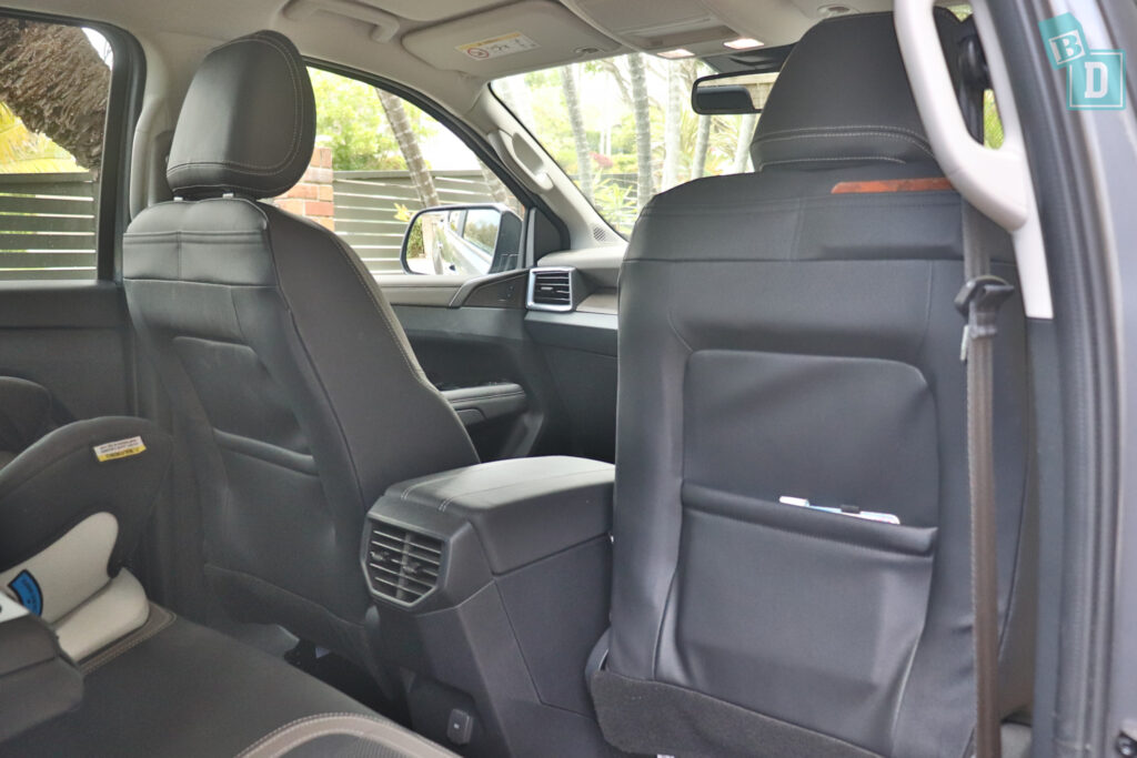 2023 Volkswagen Amarok legroom with forward-facing child seats installed in the second row

