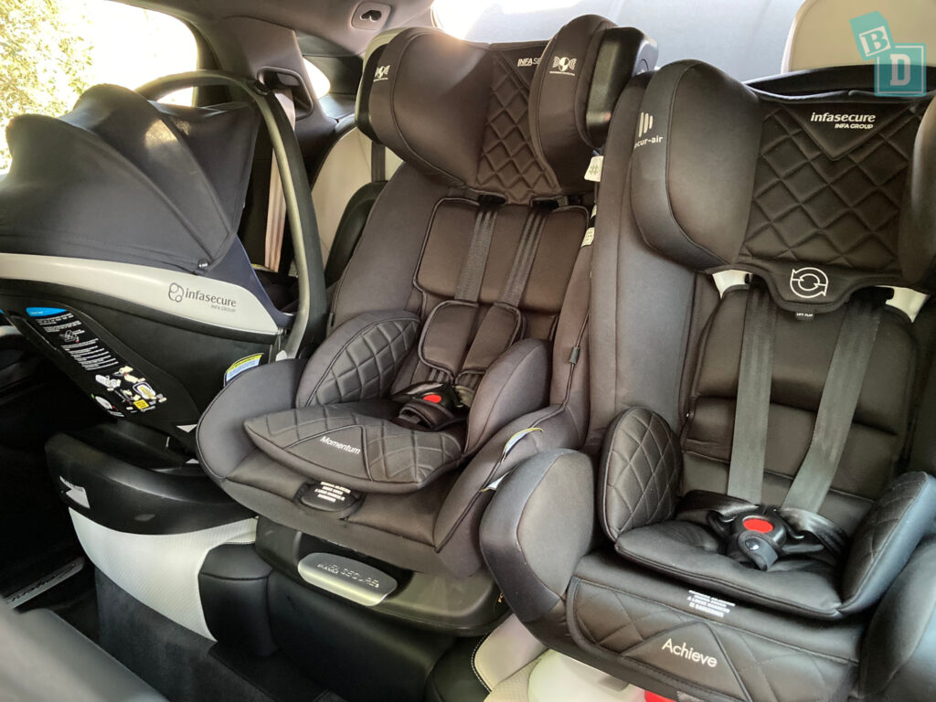 2023 Porsche Cayenne Coupe with three child seats installed in the second row

