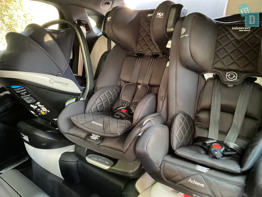 2023 Porsche Cayenne Coupe with three child seats installed in the second row
