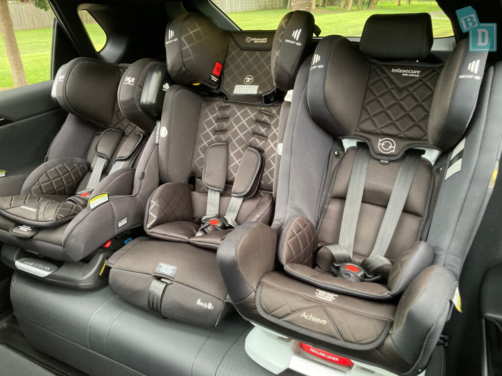 2024 Toyota bZ4X AWD with three child seats installed in the second row
