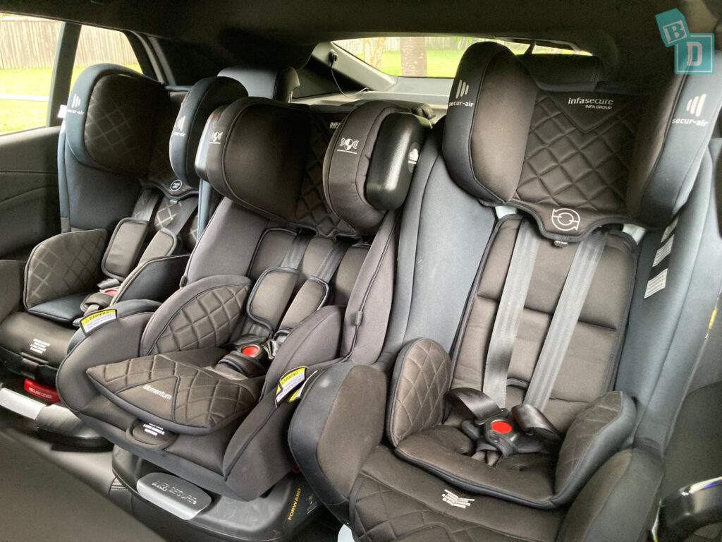 2024 BMW X2 XDrive 20i with three child seats installed in the second row
